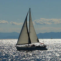 A photo of a sail boat at sea.