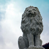 A photo of a stone lion statue.